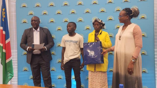 Nust student receiving his bursary at the Roads Authority in Windhoek.