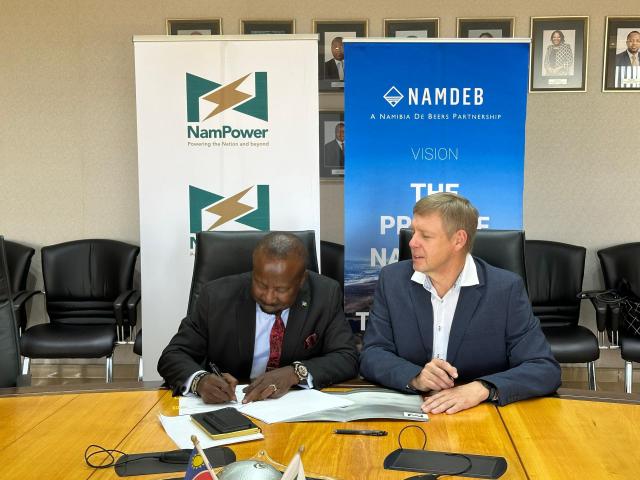 WINDHOEK, 07 May 2025 - Namdeb CEO Riaan Burger (R) and NamPower Managing Director, Kahenge Haulofu (L) signing the MoU at the NamPower Head Office in Windhoek. (Photo: Contributed) 