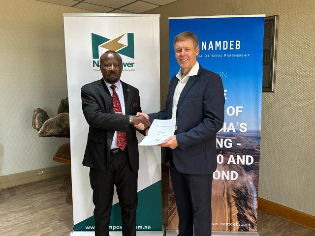 WINDHOEK, 07 May 2025 - NamPower managing director, Kahenge Haulofu and Namdeb chief executive officer, Riaan Burger are pictured as they sign a memorandum of understanding between the two entities on energy collaboration. (Photo: Contributed) NAMPA 