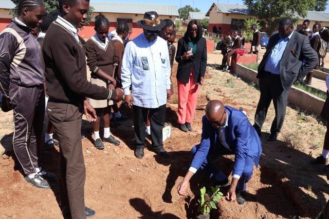 OTJIWARONGO, 12 May 2025 - Otjozondjupa Governor, John //Khamuseb (centre) headed an initiative to plant fruit trees on Monday afternoon at Otjiwarongo together with teachers and learners of the Monica Geingos Senior Secondary School to remember the late Founding President, Sam Nujoma on his birthday. (Photo by: Mulisa Simiyasa) NAMPA
