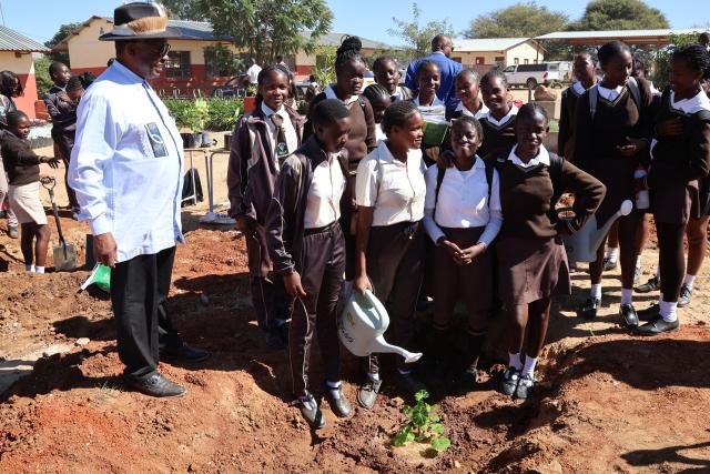 OTJIWARONGO, 12 May 2025 - Otjozondjupa Governor, John //Khamuseb (centre) headed an initiative to plant fruit trees on Monday afternoon at Otjiwarongo together with teachers and learners of the Monica Geingos Senior Secondary School to remember the late Founding President, Sam Nujoma on his birthday. (Photo by: Mulisa Simiyasa) NAMPA