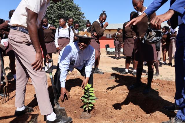 OTJIWARONGO, 12 May 2025 - Otjozondjupa Governor, John //Khamuseb (centre) headed an initiative to plant fruit trees on Monday afternoon at Otjiwarongo together with the school teachers and learners of the Monica Geingos Senior Secondary School to remember the late Founding President, Sam Nujoma on his birthday. (Photo by: Mulisa Simiyasa) NAMPA