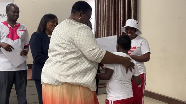 SWAKOPMUND, 16 MAY (NAMPA) - Swakopmund Constituency Councillor Louisa Kativa handing over the deed of ownership to Johanna Kambanzera, a mother to a son with disabilities, who was one of 5 Swakopmund residents with disabilities, who benefited from the donated plots. (Photo by: Isabel Bento) NAMPA