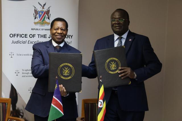 WINDHOEK, 03 June 2025 - Chief Justice Peter Shivute and Ugandan Chief Justice Alfonse Chigamoy Owiny-Dollo during the signing of MoU (Photo: Andreas Thomas) NAMPA
