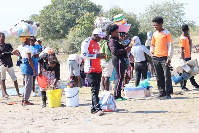 OSHIKANGO- Illegal fuel smugglers from Angola crossing the canal in Angola to Namibia borders. (Photo by: Linea Dishena) NAMPA 
