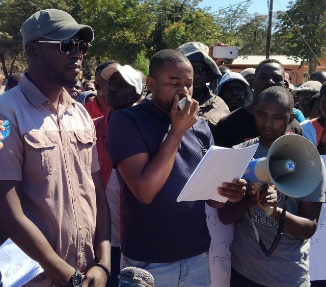 KATIMA MULILO, 25 July 2025 - A group of concerned Katima Mulilo residents in the Zambezi region on Friday staged a peaceful demonstration raising concern of mismanagement and irregularities in land allocations by KMTC. In the picture, Owen Mahoto reads out the petition outside KMTC offices.
(Photo: Michael Mutonga Liswaniso) NAMPA
