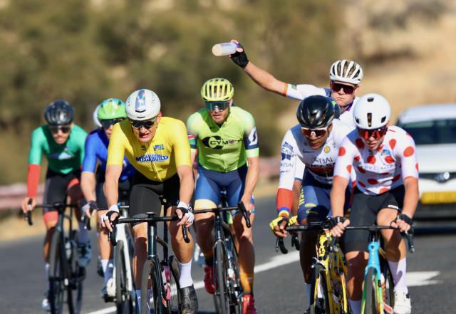 WINDHOEK, 03 August 2025 – Infront Namibian rider Drikus Coetzee (in yellow), and talented junior rider Roger Suren (polka dot jersey) while in action during the last stage of the 2025 Tour de Windhoek. Namibia’s premier international cycling event, the Tour de Windhoek, was held from 31 July to 3 August 2025 around the Namibian capital. (Photo by: Hesron Kapanga) NAMPA
