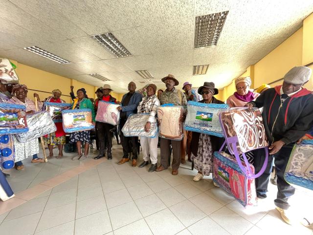 WINDHOEK, 14 August 2025 – Moses //Garoeb Constituency Councillor Stefanus Ndengu is pictured with beneficiaries who received blankets. (Photo by Mathilde Kudumo/NAMPA)
