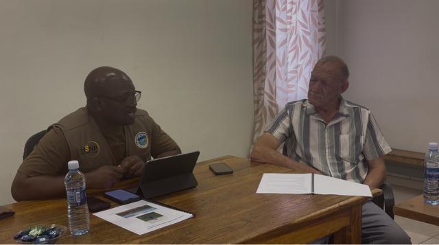 RUNDU, 18 August 2025 - Chairperson of the Parliamentary Standing Committee on Agriculture, Environment and Natural Resources Paulus Mbangu talking to the Farm manager of the Vhungu Vhungu Green Scheme Floris Smith on Monday. (Photo by: Sawi Hausiku) NAMPA 
