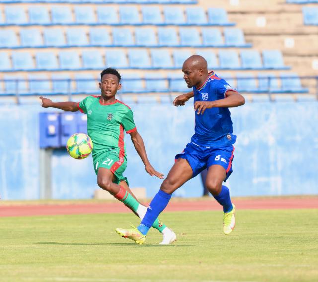 FRANCISTOWN, 05 September 2025 - Brave Warriors cetre back Charles Hambira (in blue) while in action against Robert Saizi of Malawi during Namibia's 2-1 defeat to Malawi during their 2026 World Cup qualifiers at the Obed Itani Chilume Stadium in Francistown, Botswana. (Photo by: Hesron Kapanga) NAMPA