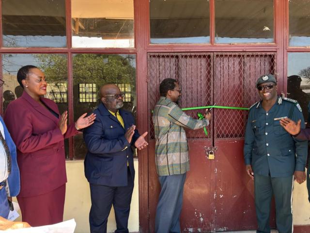 KATIMA MULILO, 02 October 2025 - The Deputy Prime Minister and Minister of Industries, Mines and Energy Natangue Ithete on Thursday officially handed-over a storage facility from Namibia Industrial Development Agency (NIDA), to the Namibia Correctional Service (NCS) at Katima Mulilo. He is pictured here marking the official handover ceremony flanked by some NIDA officials and Deputy Commissioner General Sam Tukondjela Shaalulange of the Namibia Correctional Service.

(Photo: Michael Mutonga Liswaniso) NAMPA