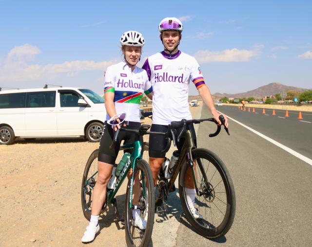 WINDHOEK, 05 October 2025  – Elite female cyclist Anri Greef (left) and Junior cyclist Roger Suren pose for a photo along the A1 highway after winning their diferent categories during the 26th edition of the Namibian Cycle Classic that saw over 500 riders, who competed across three categories: 25 kilometres (km), 60km, and 100km.  (Photo by: Hesron Kapanga) NAMPA
