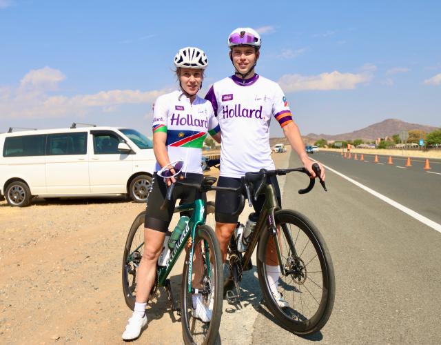 WINDHOEK, 05 October 2025  – Elite female cyclist Anri Greef (left) and Junior cyclist Roger Suren pose for a photo along the A1 highway after winning their diferent categories during the 26th edition of the Namibian Cycle Classic that saw over 500 riders, who competed across three categories: 25 kilometres (km), 60km, and 100km.  (Photo by: Hesron Kapanga) NAMPA
