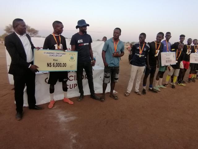 OTJIWARONGO, 13 October 2025 - The Otjiwarongo Constituency Councillor Cup came to an end on Monday with participants receiving cash, medals and a trophy from the constituency councillor, Paulus Nekundi (L) at the DRC open sports field. (Photo by: Mulisa Simiyasa) NAMPA 