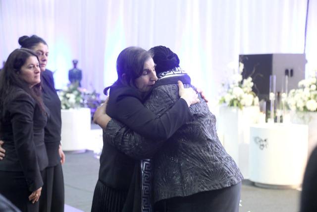 WALVIS BAY, 17 October 2025 - President Netumbo Nandi-Ndaitwah embracing Roulla Savva, the widow of the late Walvis Bay businessman John Savva and their two daughters look on. (Photo contributed) NAMPA 