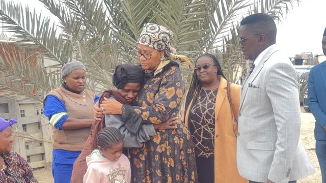 SWAKOPMUND, 20 October 2025 - Erongo Governor Natalia | Goagoses embracing and consoling 31 year old Zelda Goses, the mother of the two little girls who died in a shack fire at the DRC Informal settlement last week. She is accompanied by Mayor and Deputy Mayor of Swakopmund Blasius Goraseb and Suama Kuutondokwa. (Photo by: Isabel Bento) NAMPA