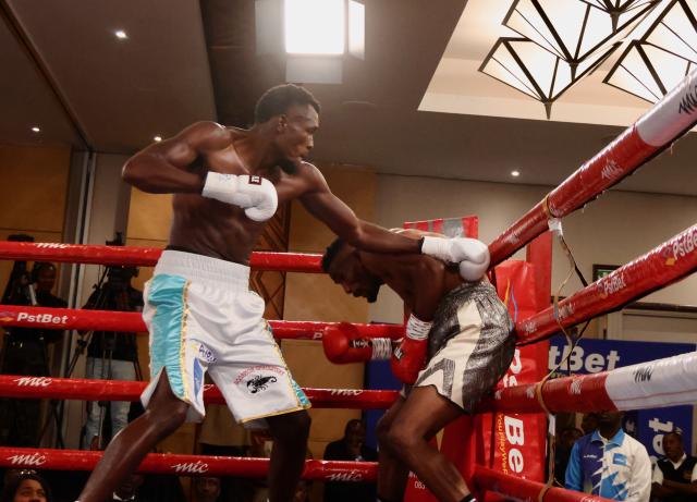 WINDHOEK, 08 November 2025 - Namibia’s super middleweight, Paulinus Ndjolonimus (in white and blue trunks), while in action against South Africa’s Snamiso Ntuli for the vacant World Boxing Organisation (WBO) Africa champions during the MTC Nestor Sunshine Tobias Boxing and Fitness Academy Boxing Bonanza, called “The Redemption Fight” at the Windhoek Country Club Resort. (Photo by: Hesron Kapanga) NAMPA