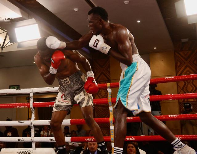 WINDHOEK, 08 November 2025 - Namibia’s super middleweight, Paulinus Ndjolonimus (in white and blue trunks), while in action against South Africa’s Snamiso Ntuli for the vacant World Boxing Organisation (WBO) Africa champions during the MTC Nestor Sunshine Tobias Boxing and Fitness Academy Boxing Bonanza, called “The Redemption Fight” at the Windhoek Country Club Resort. (Photo by: Hesron Kapanga) NAMPA