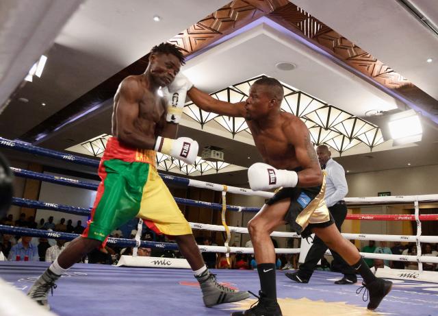 WINDHOEK, 08 November 2025 - Namibia’s featherweight, Mateus Heita (in gold and black trunks), while in action against Clement Loko of Benin for the vacant World Boxing Organisation (WBO) Africa champions during the MTC Nestor Sunshine Tobias Boxing and Fitness Academy Boxing Bonanza, called “The Redemption Fight” at the Windhoek Country Club Resort. (Photo by: Hesron Kapanga) NAMPA