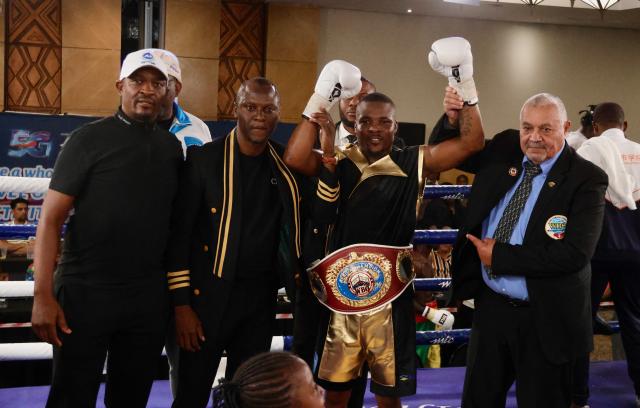 WINDHOEK, 08 November 2025 - Namibia’s featherweight, Mateus Heita (with a belt), posing for a picture after being crowned champion of the vacant World Boxing Organisation (WBO) Africa champions during the MTC Nestor Sunshine Tobias Boxing and Fitness Academy Boxing Bonanza, called “The Redemption Fight” at the Windhoek Country Club Resort. (Photo by: Hesron Kapanga) NAMPA
