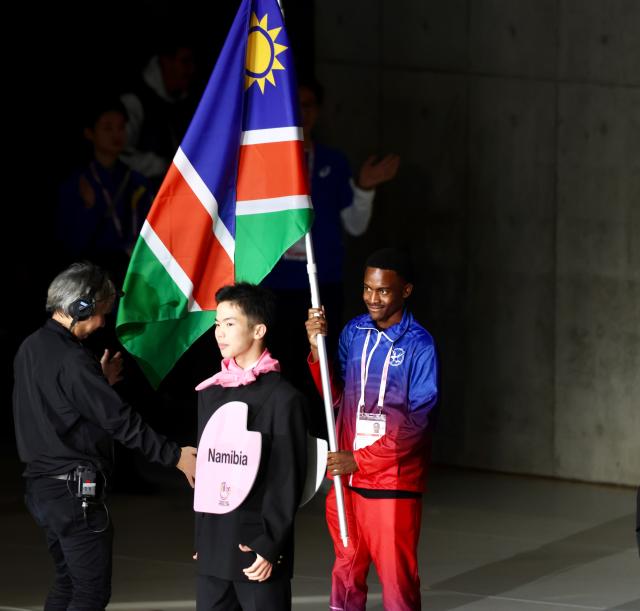TOKYO, 15 November 2025 - Namibia's flag bearer with hearing imparment parading the national flag during the opening ceremony of the 25th edition of the Deaflympics Summer Games at the Tokyo Metropolitan Gymnasium in Tokyo, Japan. (Photo by: Hesron Kapanga) NAMPA