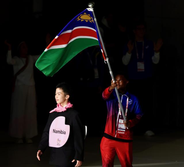 TOKYO, 15 November 2025 - Namibia's flag bearer parading the national flag during the opening ceremony of the 25th edition of the Deaflympics Summer Games at the Tokyo Metropolitan Gymnasium in Tokyo, Japan these years games also celebrated its 100th anniversary. (Photo by: Hesron Kapanga) NAMPA