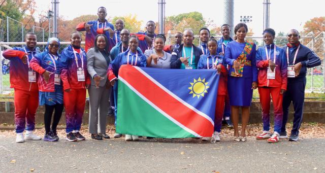TOKYO, 19  November 2025 - Deputy Head of Mission at the Embassy of Namibia in Japan, Rebecca Iyambo (centre) poses for a photo with Namibia's deaflympians and technical members and coaches as well as employees of the Namibian embassy in Japan at the Komazawa Olympic Park General Sports Ground Athletic Field training ground. (photo by: Hesron Kapanga) NAMPA 