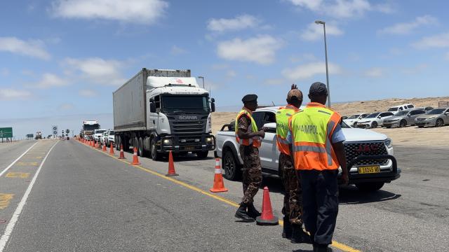 SWAKOPMUND, 09 December 2025 - Law enforcement officers intercepting vehicles at the Swakopmund roadblock as the regional road safety campaign kicks off. (Photo by: Isabel Bento) NAMPA