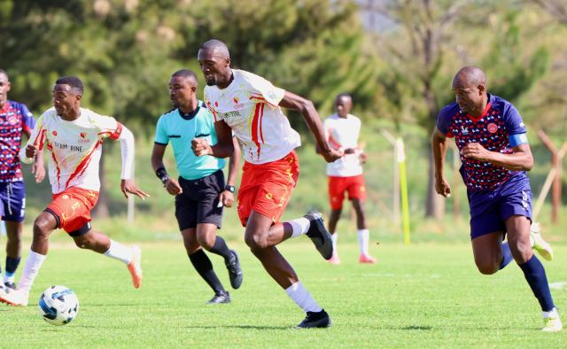 WINDHOEK, 14 December 2025 - The University of Namibia (UNAM) Football Club players in while Paulus Amutenya (right), Nestor Iyambo (Centre) and African Stars defencer, Charles Hambira while in action during Round 12 of the Namibia Premier Football League at the UNAM Stadium. The game ended 1-1 extending UNAM's unbeaten run to 12 matches during the 2025/26 Premier League  Season. (Photo by: Hesron Kapanga) NAMPA