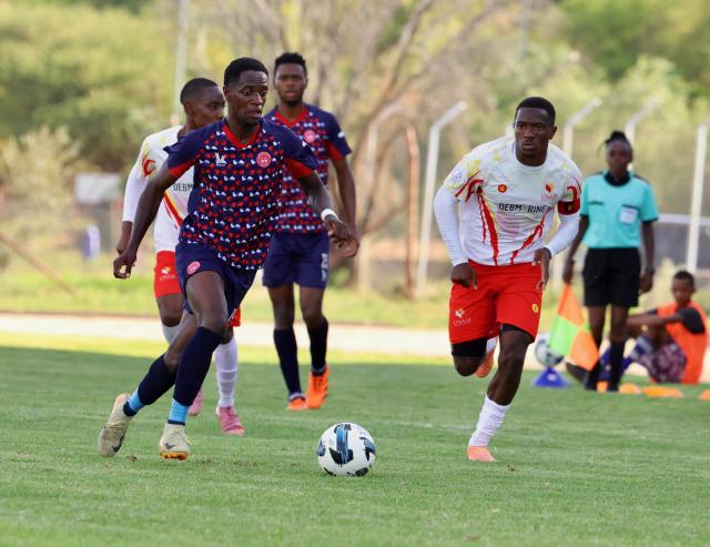 WINDHOEK, 13 December 2025 - African Stars midfielder, Jackson Eliakim (left) and Paulus Amutenya of UNAM while in action during Round 12 of the Namibia Premier Football League at the UNAM Stadium. The game ended 1-1 extending UNAM's unbeaten run to 12 matches during the 2025/26 Premier League  Season. (Photo by: Hesron Kapanga) NAMPA