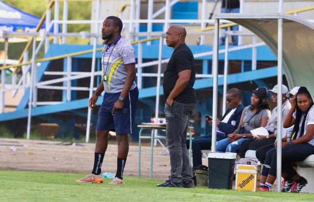 WINDHOEK, 13 December 2025 - UNAM Football Club head coach Robert Nauseb (right) and assistant coach Willem Mwedihanga during Round 12 of the Namibia Premier Football League match against African Stars at the UNAM Stadium. The game ended 1-1 extending UNAM's unbeaten run to 12 matches during the 2025/26 Premier League  Season. (Photo by: Hesron Kapanga) NAMPA