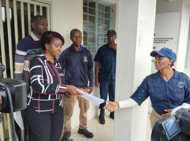 KATIMA MULILO, 22 January 2026 - Lorna Shalyefu, the acting administration head at the regional office of the Ministry of Justice and Labour Relations, receives a petition from security guards from various firms who staged a peaceful demonstration at Katima Mulilo on Thursday. (Photo by: Michael Mutonga Liswaniso) NAMPA

