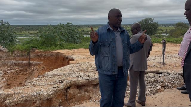 RUNDU, 22 January 2026 - Minister of Urban and Rural Development James Sankwasa assessing extent of sinkholes at Rundu on Thursday. ( Photo by: Sawi Hausiku) NAMPA 