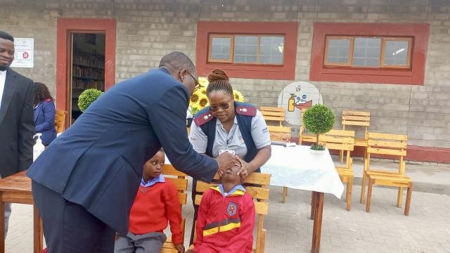 SWAKOPMUND, 27 January 2026 - Swakopmund Constituency Councillor Victor Maswahu administering polio vaccination drops to a child at the Hanganeni Primary School during the launch of the campaign. (Photo contributed) NAMPA