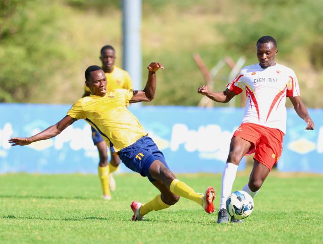 WINDHOEK, 31 January 2026 - Otjiwarongo-based Namibia Premier Football League (NPFL) outfit Mighty Gunners striker Mashiku Muyeka (in gold and black) while in action against UNAM FC during round 14 of the 2025/26 season at the UNAM Stadium. Mighty Gunners handed UNAM their first defeat after going unbeaten in 13 league matches. (Photo by: Hesron Kapanga) NAMPA

