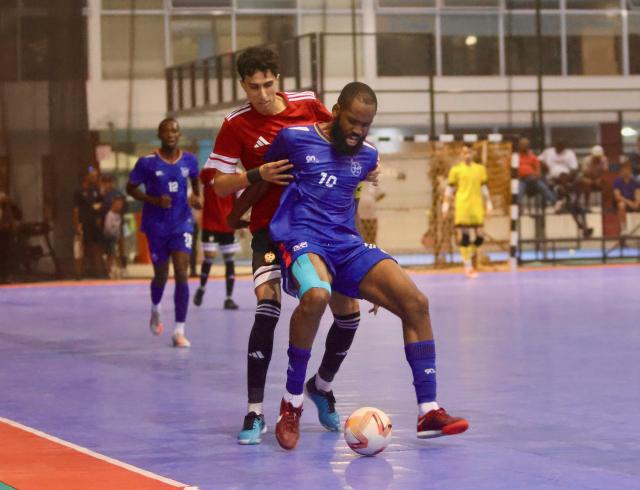 SWAKOPMUND, 04 February 2026 - Namibia's Ken Salote (in blue) in action against Libya during the 2026 Morocco CAF Futsal AFCON qualifiers at The Dome in Swakopmund. Namibia lost the match 3-11 in the first leg of their round two CAF qualifiers. (Photo by: Hesron Kapanga) NAMPA 
