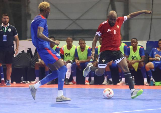 SWAKOPMUND, 04 February 2026 - ‘Brave Fives’ player Immanuel Angula (in blue) and Said Mohamed of Libya in action during the 2026 Morocco CAF Futsal AFCON qualifiers at The Dome in Swakopmund. Namibia lost the match 3-11 in the first leg of their round two CAF qualifiers. (Photo by: Hesron Kapanga) NAMPA 
