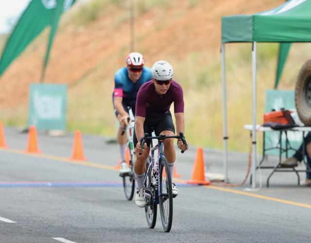 WINDHOEK, 08 February 2026 - Junior rider Roger Suren (in meroon) while in action against Alex Miller during the 2026 Nedbank Namibia National Road Race champions. Suren was crowned national champion for 2026 in the road race after completing the 167 kilometres race  that saw them ride through the new A1 and Dordabis road. (Photo by: Hesron Kapanga) NAMPA
