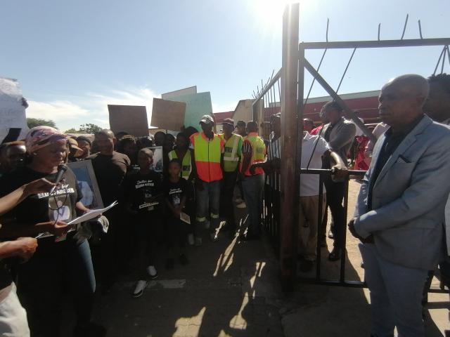 OTJIWARONGO, 16 February 2026 - Otjozondjupa Regional Health Director, Gebhardo Timoteus (R) on Monday morning waiting to receive a petition from the Otjiwarongo community members agrieved of a deteriorating healthcare service delivery at the Otjiwarongo State Hospital. (Photo by: Mulisa Simiyasa) NAMPA 