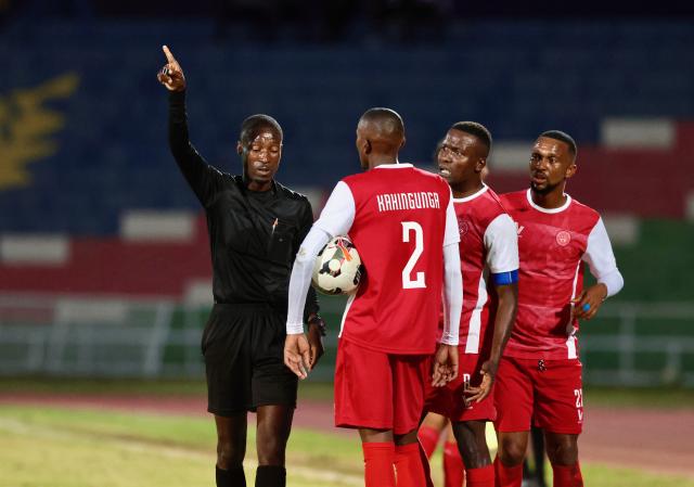 WINDHOEK, 20 February 2026 - African Stars players surrounding the referee in a match against Mighty Gunners during round 19 of the Namibia Premier Football League (NPFL) at the Independence Stadium. African Stars secured a 1-0 victory over Mighty Gunners in a high-stakes clash between defending champions African Stars and Mighty Gunners, who entered the encounter separated by a single point in second and third place, respectively. (Photo by: Hesron Kapanga) NAMPA
