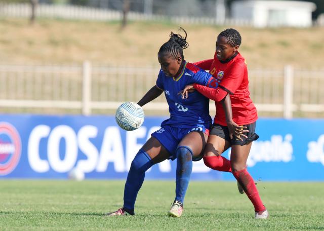 WINDHOEK, 20 February 2026 - Lovisa Tuyakula Mulunga of Namibia shields ball from Angila Mutula of Mozambique during the 2025 Hollywoodbets COSAFA Womens Championship match between Mozambique and Namibia at the Old Peter Mokaba Stadium, Polokwane. (Photo: Contributed) NAMPA