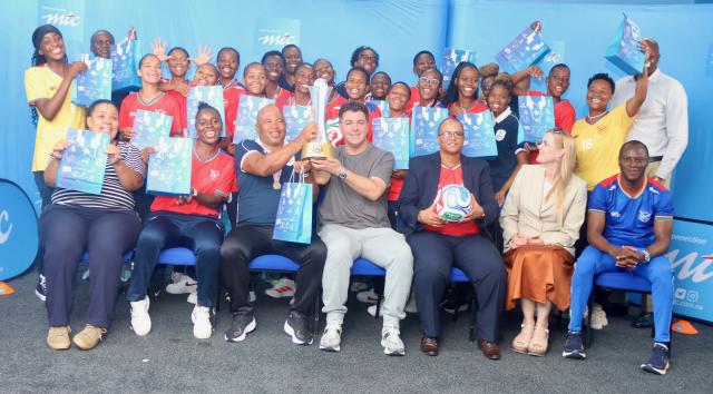 05 March 2026 - The senior national women’s football team, the Brave Gladiators, poses for a photo with MTC MTC’s Chief Brand, Marketing, Communications and Sustainability Officer, Tim Ekandjo (seated in blue) and Deputy Minister of Education Inovation, Youth, Sport, Arts  and Culture, Dino Balloti. The team received N.dollars 300,000 following their historic triumph at the Hollywoodbets COSAFA Women's Championship that was played in South Africa. (Photo by: Hesron Kapanga) NAMPA