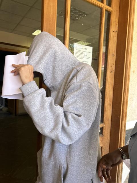 WINDHOEK, 10 MARCH 2026- Murder suspect Andrea Ferris, hiding from cameras at the Windhoek Magistrate’s Court, in Katutura. (Photo by Eba Kandovazu). NAMPA