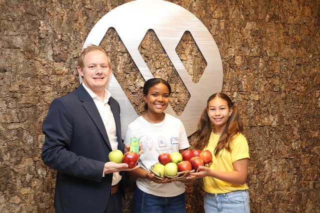 WINDHOEK, 11 March 2026 - From left to right, Bank Windhoek’s Managing Director, James Chapman, pictured with learners, Allegra Christovao and Arabella Mostert during the launch of the Cancer Apple Project for 2026. 

(Photo contributed)