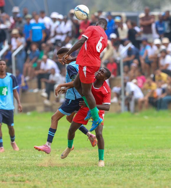 KEETMANSHOOP, 03 April 2026 - Battle for the ball between Kavango West players Andreas Ndara, Mikka Kapanda (in red) and ||Kharas player Johan Vries during the 24th edition of the Nedbank Namibian Newspaper Cup at the Westdene Stadium in Keetmanshoop. The opening match between the two sides in Group B, ended 2-1 in favour of ||Kharas. (Photo by: Hesron Kapanga) NAMPA