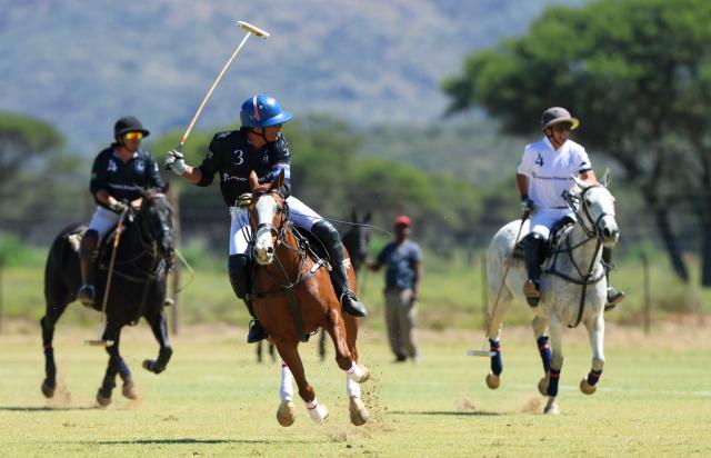 WINDHOEK, 18 April 2026 - Mariano Mazzitelli (in black) of La Muela Polo Club while in action against Eduardo Menendez (in white) of Maranatha Polo Club during the country’s first-ever polo exhibition match at Farm Gocheganas, just outside Windhoek. La Muela Polo Club won the match 7-5. (Photo by: Hesron Kapanga) NAMPA