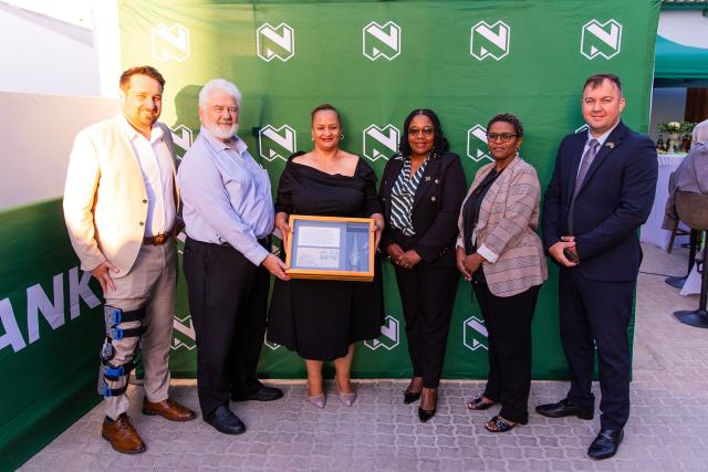 LUDERITZ, 27 April 2026 - John J Tromp, Head: Consumer Banking, Nedbank Namibia; Ulf Grünewald, General Manager, Lüderitz Nest Hotel; Hon. Cllr Briggitte Fredericks, Mayor of Lüderitz; Hon. Cllr Suzan Ndjaleka, Regional Councillor, NamiNus Constituency; Rebekka Nongxaza, Sales- Executive, Nedbank Namibia; Hon. Cllr Ockert Theron, Chairperson of Management council, Lüderitz. 

(Photo contributed) NAMPA 