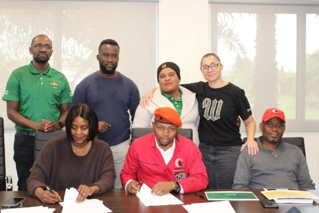 WINDHOEK, 30 April 2026 - The Namibian Revolutionary Transport and Manufacturing Union's (NARETU), Commander-in-Chief Petersen Kambinda (R) and Namibia Breweries Limited's (NBL) People Director Vivian Kaposambo (L) sign an agreement in Windhoek. (Photo: Contributed) NAMPA