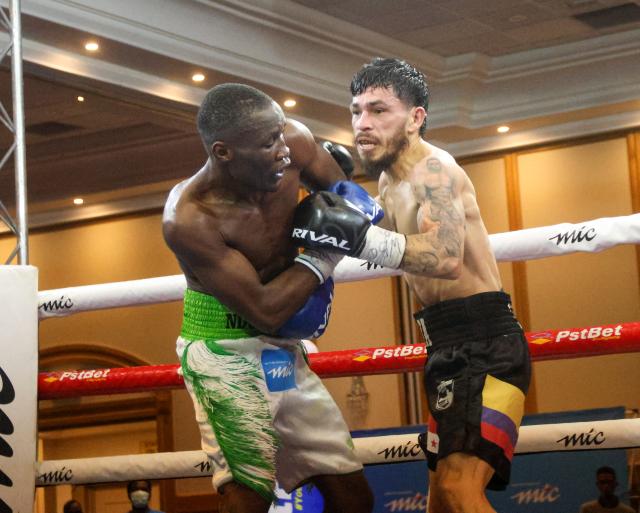 WINDHOEK, 09 May 2026 – Namibia’s World Boxing Organisation (WBO) Global Super Bantamweight champion, Fillipus Nghitumbwa (in green and white), while in action against Colombia’s Leonardo Carrillo in Windhoek. Nghitumbaw successfully retained his title after an impressive performance. (Photo by: Hesron Kapanga) NAMPA