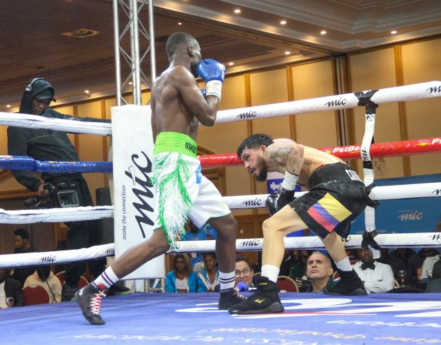 WINDHOEK, 09 May 2026 – Namibia’s World Boxing Organisation (WBO) Global Super Bantamweight champion, Fillipus Nghitumbwa (in green and white), while in action against Colombia’s Leonardo Carrillo in Windhoek. Nghitumbaw successfully retained his title after an impressive performance. (Photo by: Hesron Kapanga) NAMPA